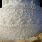 Base of a White Scrollwork Wedding Cake